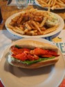 Lobster roll, fries with gravy, and cole slaw at Goobies Big Stop